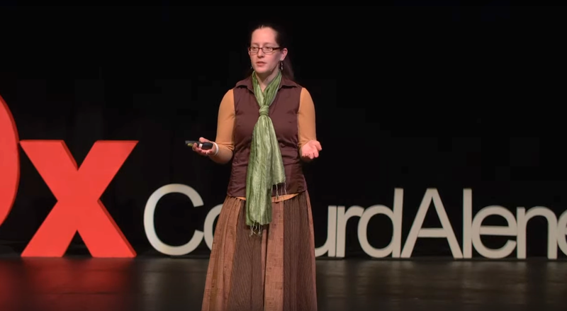 Jacqueline speaking on stage at TEDx Couer d'Alene 2020